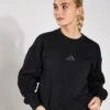 ADIDAS ALL SZN Fleece Loose Sweatshirt - Black -The Sports Edit Adidas W ALL SZN SWEAT BLACK IX3812 0008