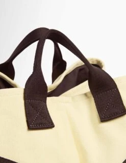 Sweaty Betty SB Canvas Bucket Bag - Buttercream Yellow -The Sports Edit sweaty betty sb canvas bucket bag buttercream yellow sb10224 4