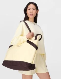 Sweaty Betty SB Canvas Bucket Bag - Buttercream Yellow -The Sports Edit sweaty betty sb canvas bucket bag buttercream yellow sb10224 8